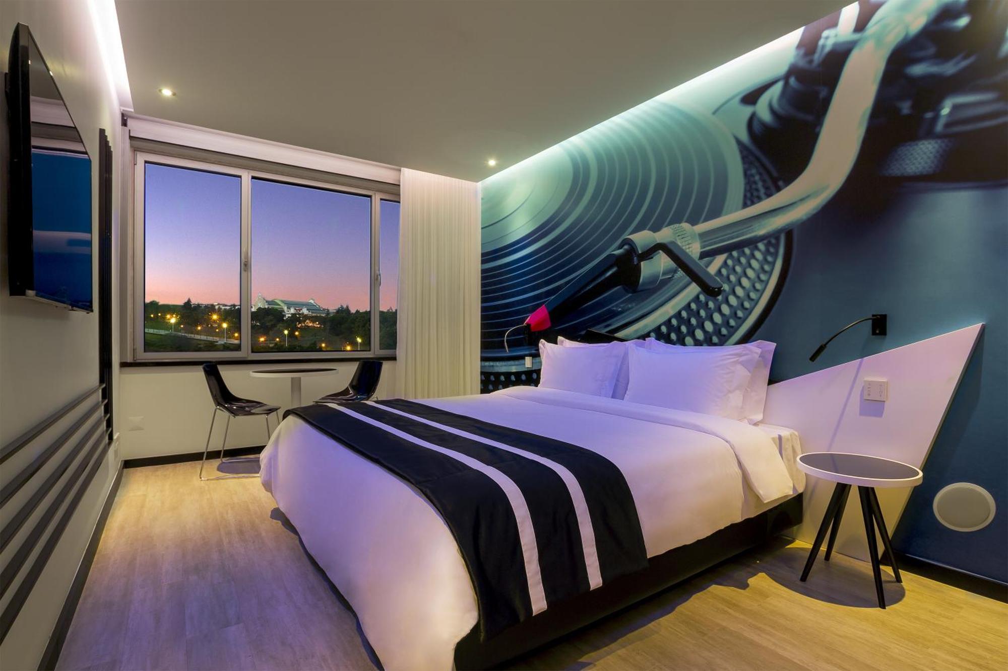 Acomodação Melody com Cama King-size